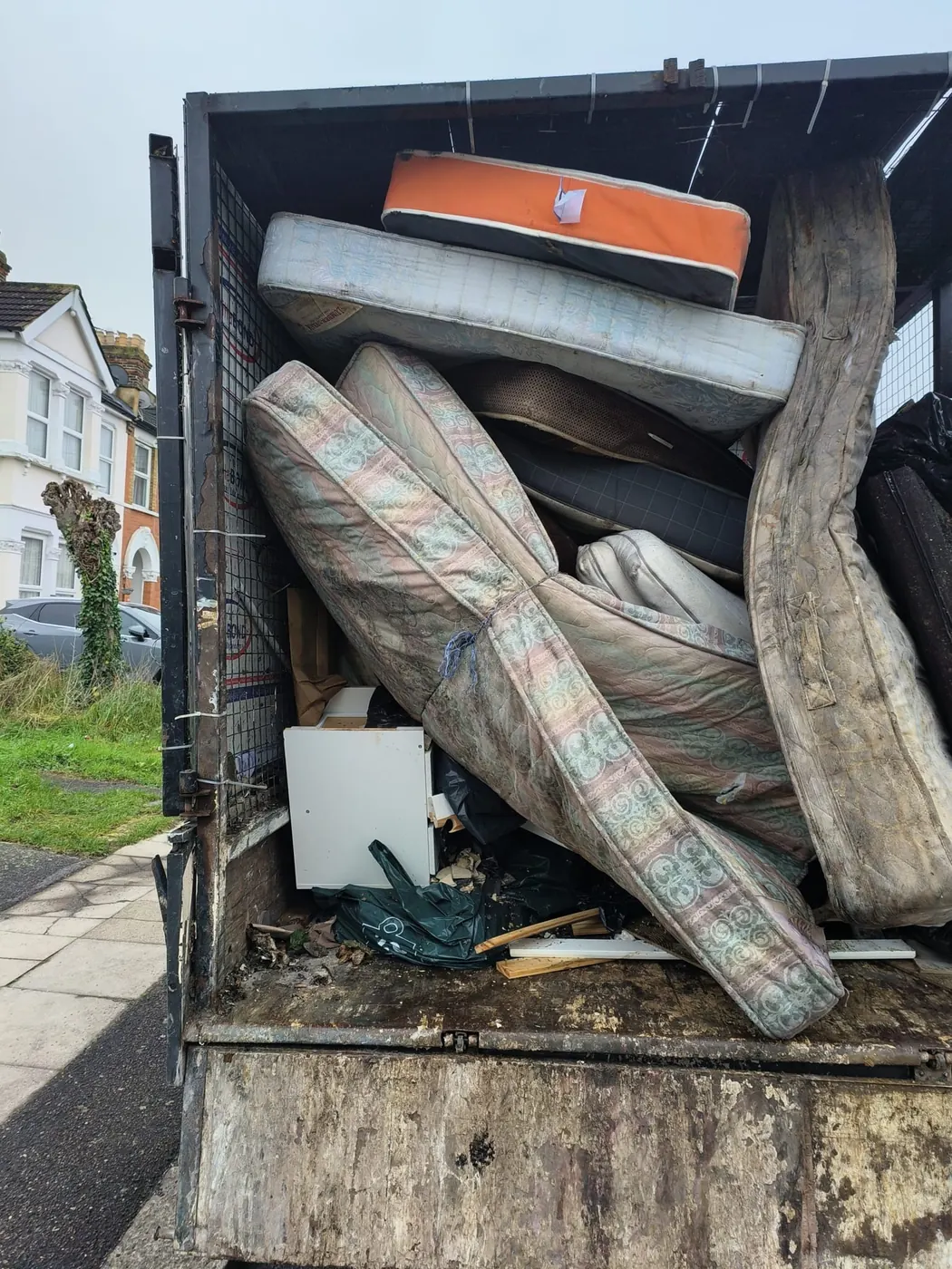 WasteMove van loaded with old mattresses collected in London