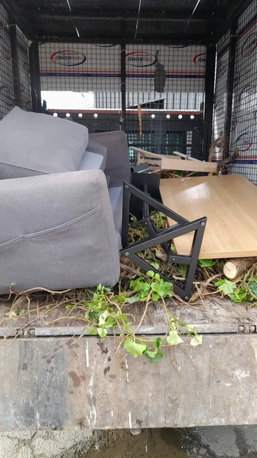 Sofa loaded into a WasteMove van with other furniture